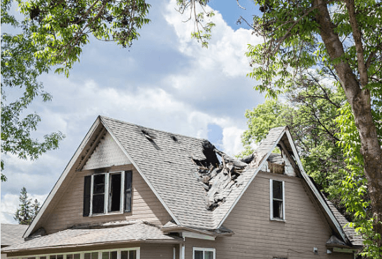 Damaged home exterior after a storm, the kind of property loss that may qualify for a casualty loss tax deduction